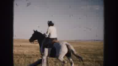 South Dakota (1953): Woman On A White And Brown Horse Riding In A Wheat Fields