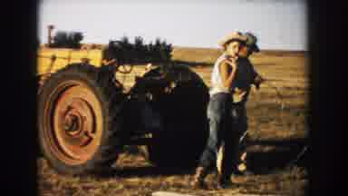 South Dakota (1953): Two Men And A Woman Operate A Tractor Machine During Farming