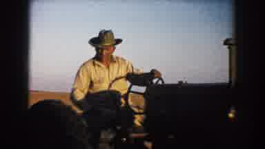 South Dakota (1953): A Man Rides On A Tractor During A Farm Operation