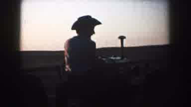 South Dakota (1953): Operating A Machine On The Heart Of The Farmland As Evening