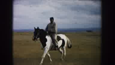 South Dakota (1953): Man Riding A Horse In The Desert