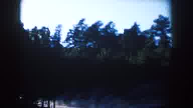 South Dakota (1953): Passing View Of Tan Mountain Blue Sky And Trees On A Clear
