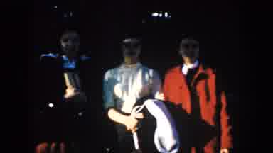 South Dakota (1953): Three Guys At A Concert With A Lot Of Other People Having Fun