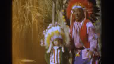 Knotts Berry Farm California (1961): A Woman And A Boy Dressed Colorfully For A