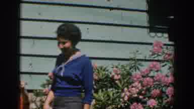 GREECE-1962: Woman and Boy in Garden with Pink Flowers