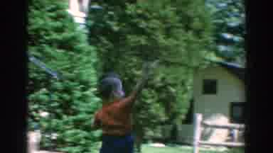 GREECE-1962: A Child Playing In His Yard