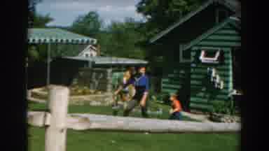 Greece (1962): Mother Showing Her Son The Backyard Of A House