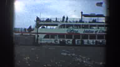 New York City (1960): Adult Female Happy To See Passengers On A Ferry On The Water