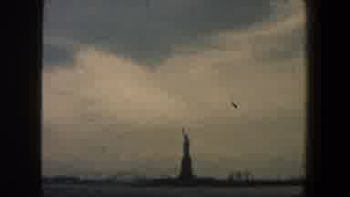 New York City (1960): Woman Looking At Distant View Of Ellis Island And Statue Of