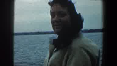 New York City (1960): A Woman Aboard A Ship Enjoys The View Of The Ocean