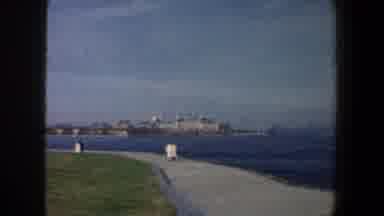 New York City (1960): View Of City Skyline And Blue Ocean Water On A Cloudy Day
