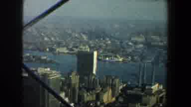 New York City (1960): View Of City Buildings And Blue River Water On A Clear Day