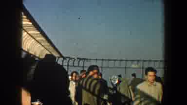 New York City (1960): View Of Crowd Standing Behind Barbed Wire Fence On A Clear