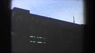New York City (1960): Blue Sky Grainy Video Large Building Two Cars One Person Not