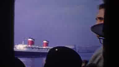 New York City (1960): A Man Looking Into The Sky While Looking At The Boat