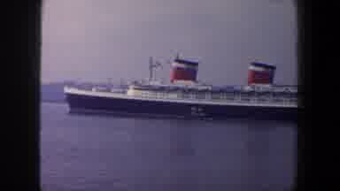 New York City (1960): Ship With Two Smokestacks Anchored In Harbor Water Surface