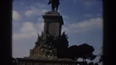 Rome Italy (1959): Cars Drive Past A Decorated Equestrian Monument In Front Of