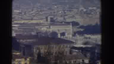 Rome Italy (1959): Panning City Scene Showing Buildings Trees Park Statue And Sky