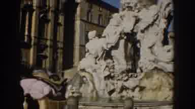 Rome Italy (1959): A Large Stone Statue Of Many People With People Walking In The