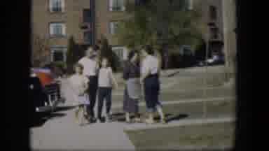 Nevada (1954): Five People Stand Near Red Brick House On A Bright Sunny Day