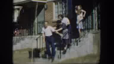 Nevada (1954): Family Of Adults And Children On Steps Outside A House