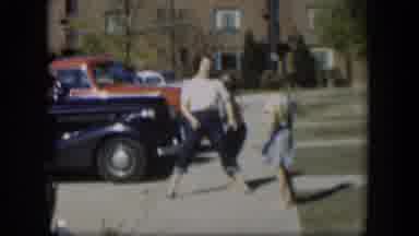 Nevada (1954): One Adult Woman And Two Female Children Playing Outside On The