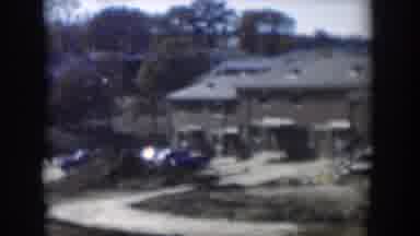 Nevada (1954): A Car That Runs On Dirt Road With Many Cars Lined Up