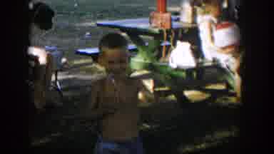Nevada (1954): Two Boys Wave At A Man While Playing In The Field