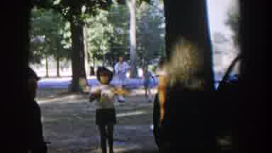 Nevada (1954): Girl Wearing White Dress With Black Shoes Brings Brown And White