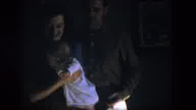 Nevada (1954): Woman Wearing Blue Dress Holds Small Baby Wearing White Shirt