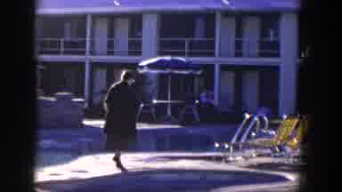Nevada (1954): Woman In Classic Tweed Ensemble And Heel Strolls Around Pool Area