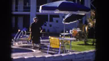 Nevada (1954): A Woman Dressing Black Clothes Walking By The Side Of A Pool And