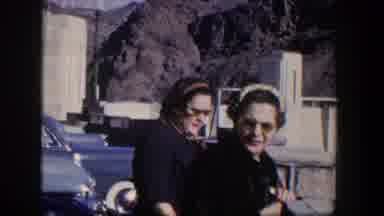 Nevada (1954): Two Women In Glasses Next To Blue Car Are Talking Near Some