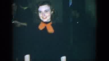 Houston Texas (1952): Smiling Lady In Dark Attire And Orange Scarf Posing For
