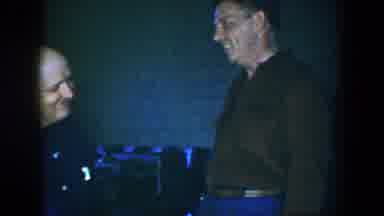 Houston Texas (1952): Men Man Two Men Blue Jeans Blue Shirt Brick Wall Seats