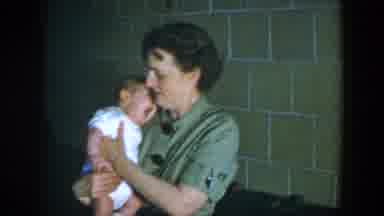 Houston Texas (1952): Woman Adorably Holding A Cute Sleepy Newborn Baby Wearing A