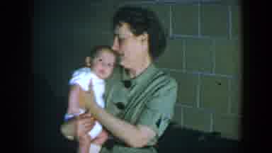 Houston Texas (1952): A Woman Talks To Her Baby As She Nudges Him To Sleep