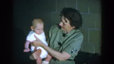 Houston Texas (1952): Woman Holding A Baby A Little Restless Next To Someone Else
