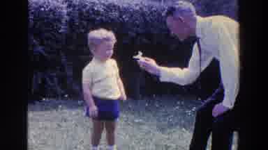 Ireland (1961): Man In Suit Showing An Object To A Child
