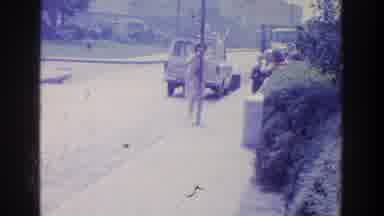Ireland (1961): A Man And A Boy Stands In Front Of An Apartment Besides The