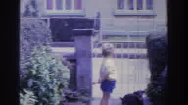 Ireland (1961): Cute Boy Playing With Dog And Man In The Garage Near Street