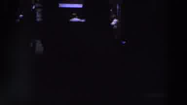 IRELAND-1961: Dark Indoor Gathering With Silhouetted Figures And Blue Light