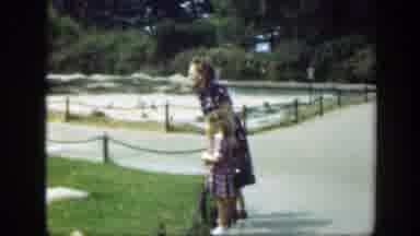 Washington DC (1948): Woman Wearing Blue Dress Feeds Birds With Girl Wearing