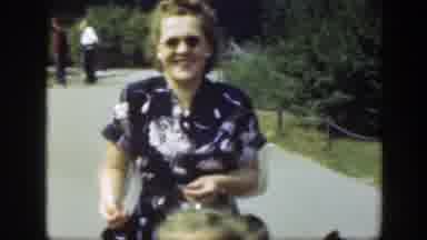 Washington DC (1948): A Woman Walks Her Two Kids Along After Having Fun In The