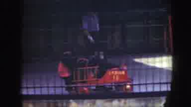 Washington DC (1948): Two Chimpanzees Ride In Red Toy Car On A Clear Day