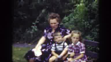 Washington DC (1948): A Woman Relaxing With Her Two Daughters As She Sits In A