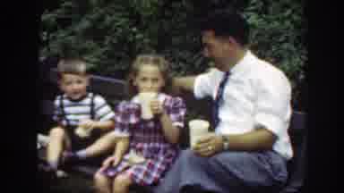 Washington DC (1948): A Family Sitting Together On A Park Bench Drinking Soda And