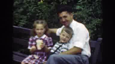 Washington DC (1948): A Man Having Fun With His Two Daughters Smiling