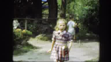 Washington DC (1948): Girl Wearing Purple Plaid Dress Walks Towards Woman Wearing