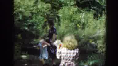 Washington DC (1948): A Woman Walk Her Kids Through The Garden In The Yard